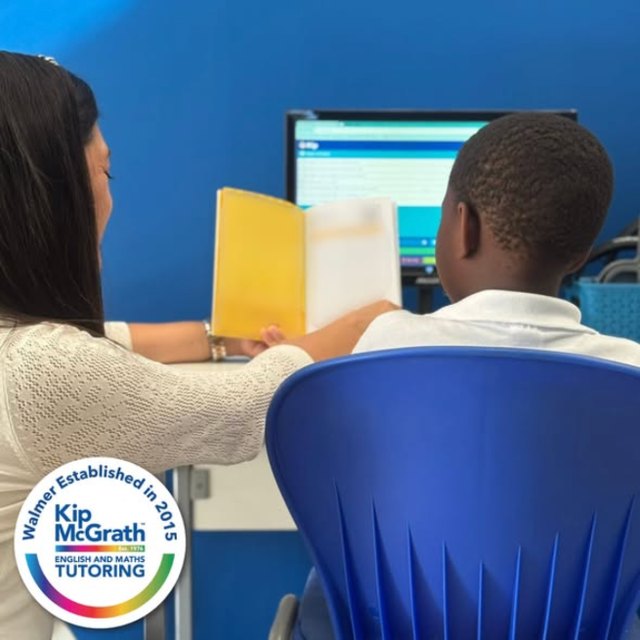 A tutor reading with a learner at Kip Walmer – Kip McGrath Walmer Facebook post